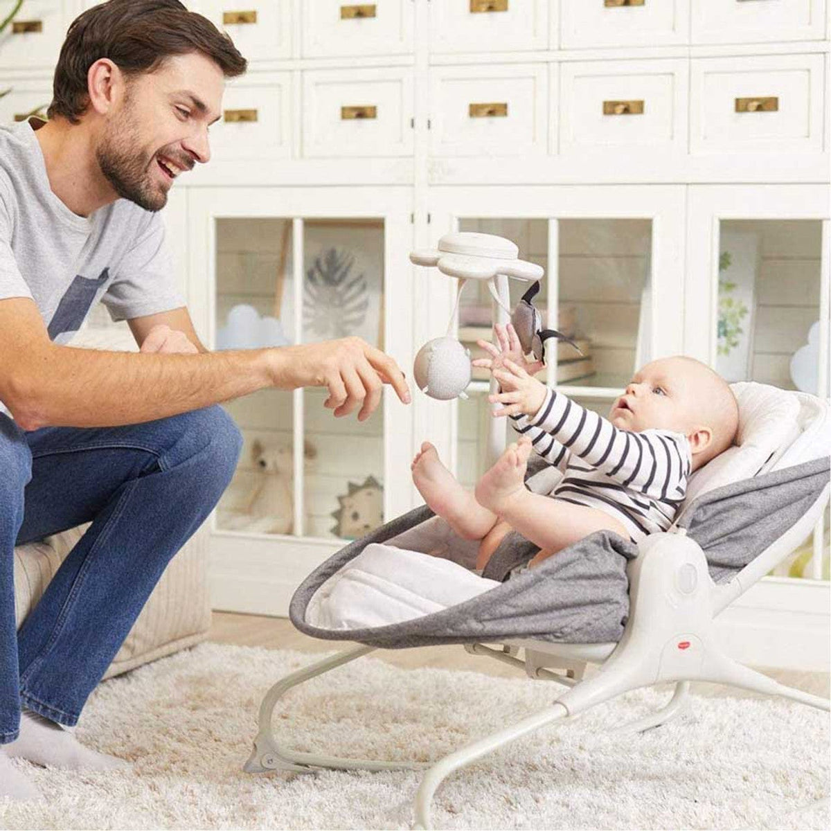 Tiny Love 3-in-1 Rocker-Napper – parent playing with baby